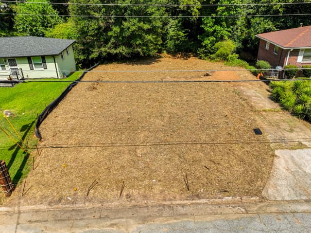 Elevated front view of the vacant lot from across the street