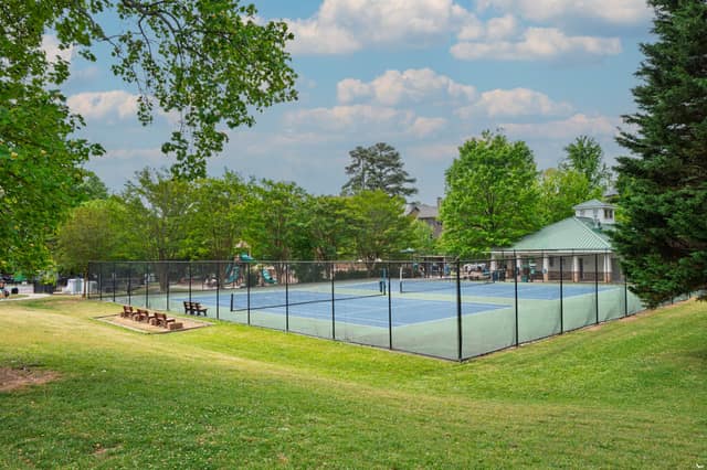 Tennis courts and playground at Ashford Park in Brookhaven